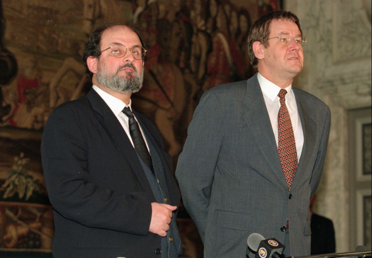 Rushdie and Danish Prime Minister Poul Nyrup Rasmussen talk to the press at Christiansborg Castle in Copenhagen on November 13, 1996. Rushdie traveled to Copenhagen to receive a literary award after the Danish government canceled earlier plans because of a threat to Rushdie's life.
