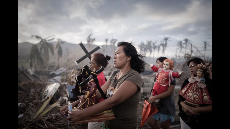 <strong>1st Prize Spot News Single: </strong>Survivors of Super Typhoon Haiyan march during a religious procession in Tolosa, Philippines. One of the strongest cyclones ever recorded, Haiyan left 8,000 people dead and missing and more than 4 million homeless in the central Philippines.