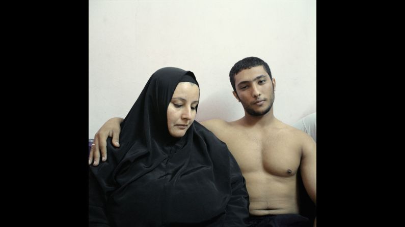 <strong>2nd Prize People -- Staged Portraits Stories:</strong> Ali, a young Egyptian bodybuilder, poses with his mother.