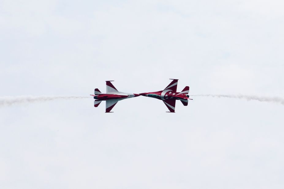 The Republic of Singapore Air Force's Black Knights perform maneuvers in F-16C Fighting Falcon jets during an aerobatic flying display on February 11.