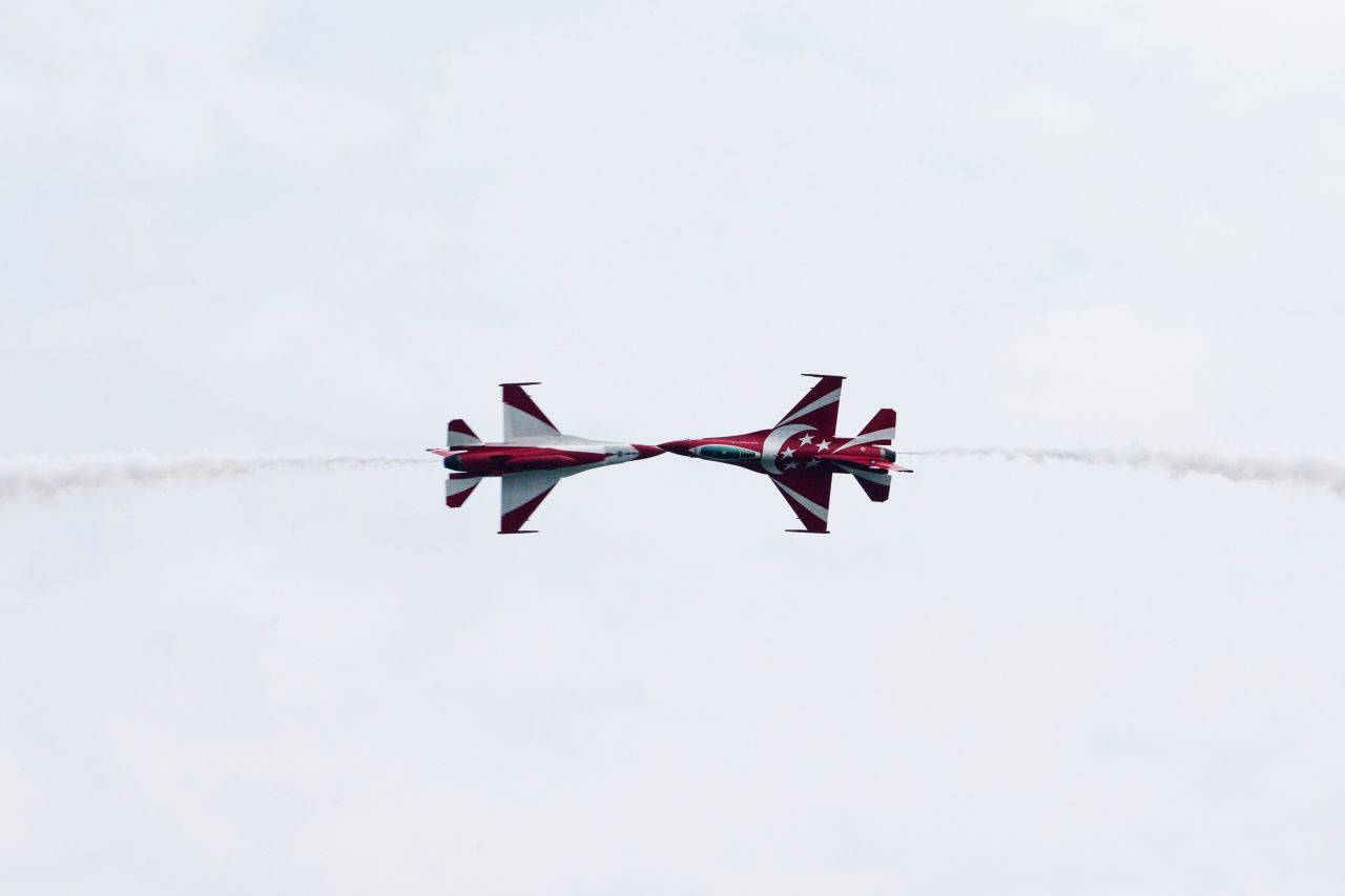 The Republic of Singapore Air Force's Black Knights perform maneuvers in F-16C Fighting Falcon jets during an aerobatic flying display on February 11.