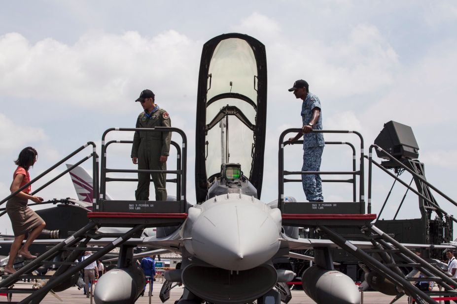 People are shown a Lockheed Martin Corp. F-16D Fighting Falcon aircraft on Thursday, February 13.