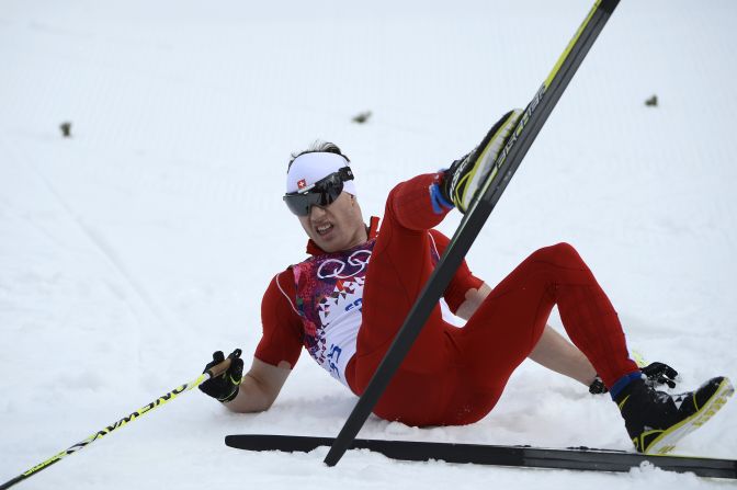 Switzerland's Dario Cologna crosses the finish line to win gold in the men's 15-kilometer classic on February 14.