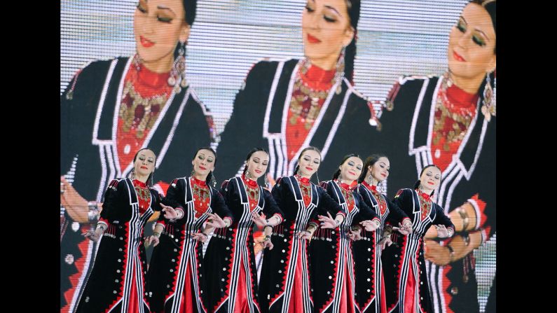 A traditional Russian dance is performed on stage during a medal ceremony February 12. 