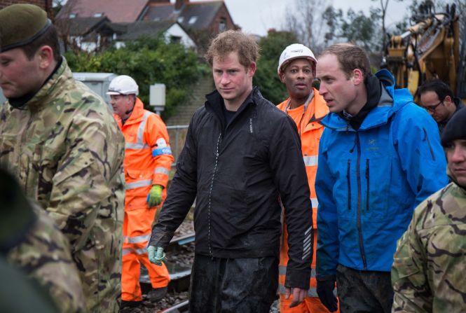 Prince Harry, in black, and Prince William, in blue, join members of the British Armed Forces to help defend the village of Datchet, England, from flooding on Friday, February 14. Nearly 6,000 homes in southern England have been flooded since the beginning of December.
