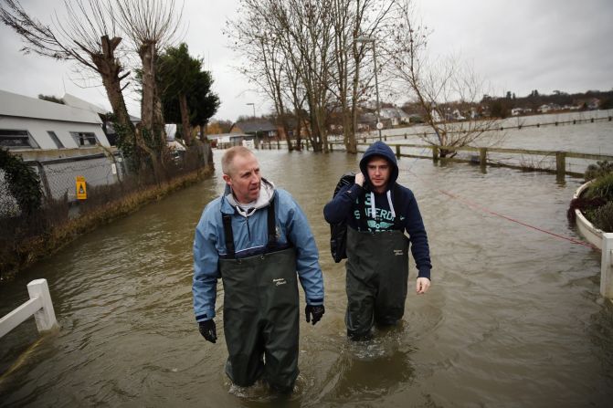 Residents collect possessions from their home next to the River Thames in Shepperton, England.