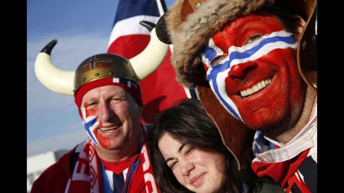 Norwegian visitors pose for a photo at the Olympic Park on February 14.