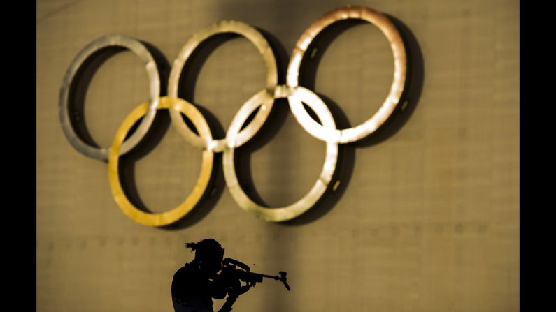 Russia's Olga Podchufarova shoots at the range February 14 during a warm-up for the women's 15-kilometer biathlon.