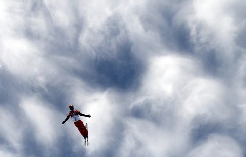 China's Zhang Xin takes a warm-up run before the start of the women's aerials competition on February 14.