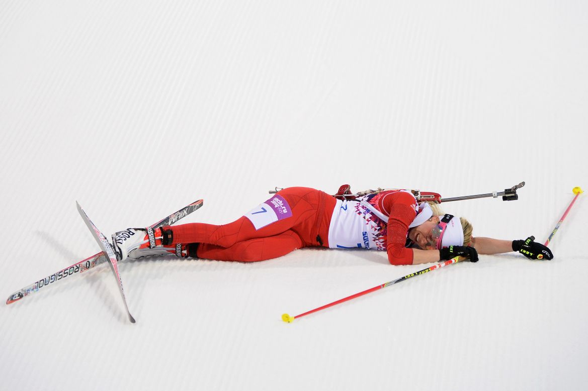 Cross-country skier Elisa Gasparin of Switzerland collapses at the finish line of the women's 15-kilometer race on February 14.