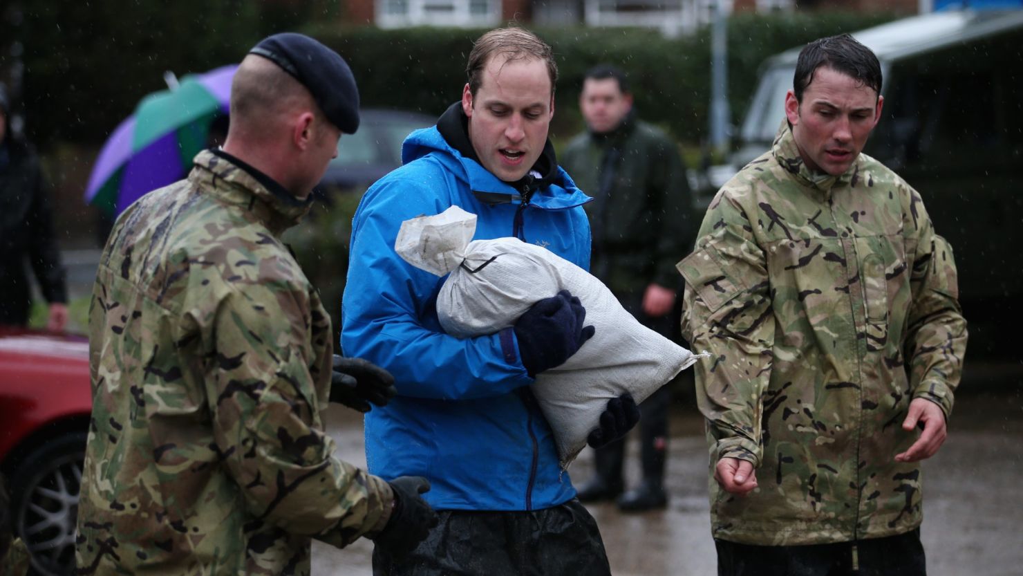 Prince William, Duke of Cambridge, helps with flood defenses on February 14, 2014 in Datchet, United Kingdom. 