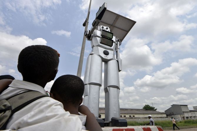 The eight feet-tall machines are designed to help drivers and pedestrians traverse the roads safely. 