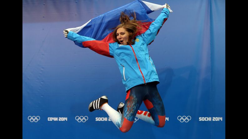 Elena Nikitina of Russia celebrates her bronze medal after the skeleton final on February 14.
