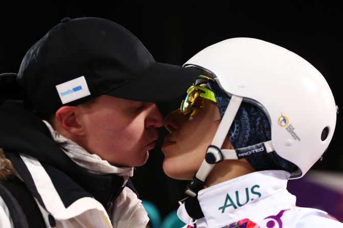 Bronze medalist Lydia Lassila of Australia kisses her husband, Lauri, after the flower ceremony for the women's aerials on February 14. 
