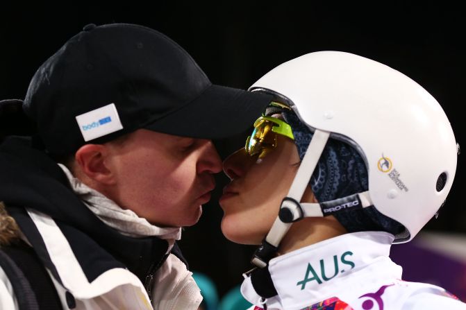 Bronze medalist Lydia Lassila of Australia kisses her husband, Lauri, after the flower ceremony for the women's aerials on February 14.