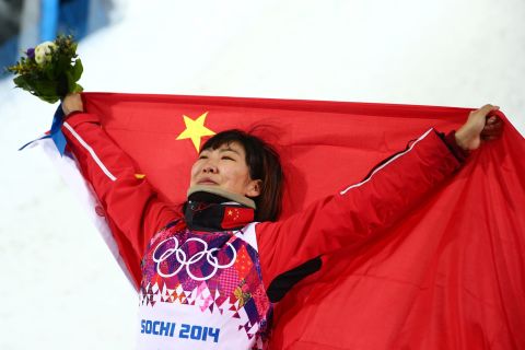 Silver medalist Xu Mengtao of China celebrates during the flower ceremony for the women's aerials on February 14.