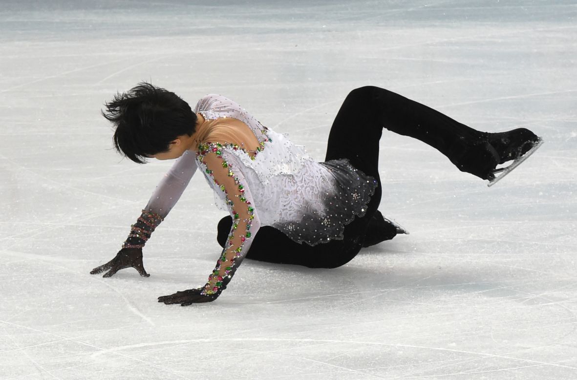 Japan's Yuzuru Hanyu falls as he performs in the men's figure skating event on February 14.