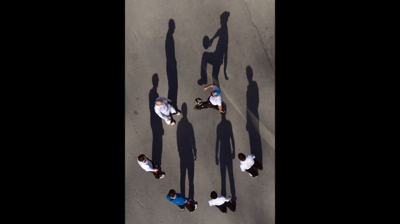 Austrian ski jumpers warm up during training on February 15.