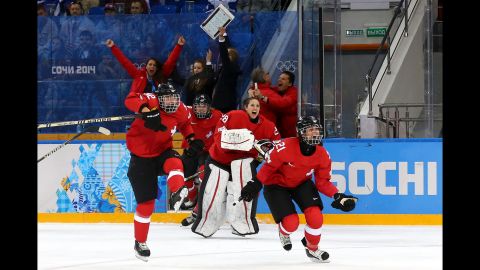 Switzerland celebrates winning 2-0 against Russia in the women's ice hockey quarterfinals.