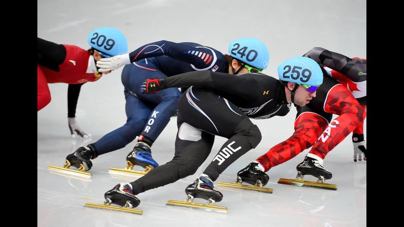 American Chris Creveling, center, competes during a men's 1,000-meter short track speedskating race on February 15. 