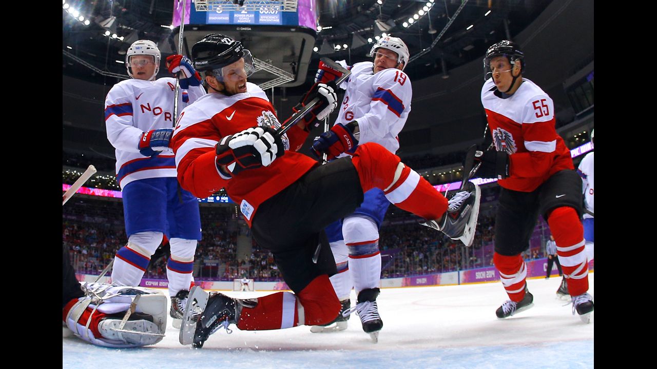 Thomas Pock of Austria falls to the ice in front of the net during the men's hockey game against Norway on February 16.