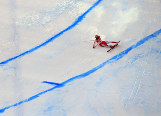 Canada's Erik Guay falls during the men's super-G.