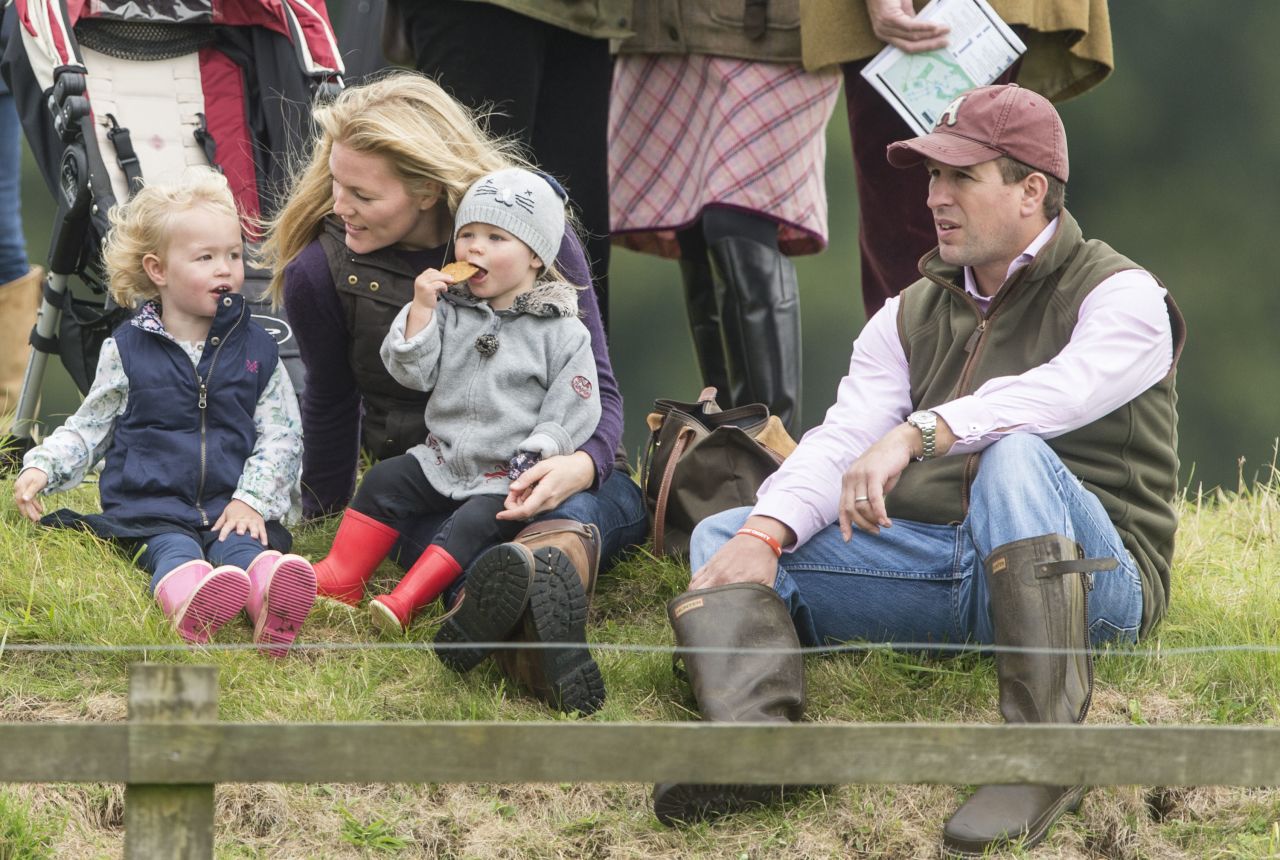 Autumn Phillips, the wife of Peter Phillips, attends the Gatcomb Horse Trials in Minchinhampton, England, with daughters Isla and Savannah in September 2013. Peter Phillips is the oldest grandchild of Queen Elizabeth II and Prince Philip.