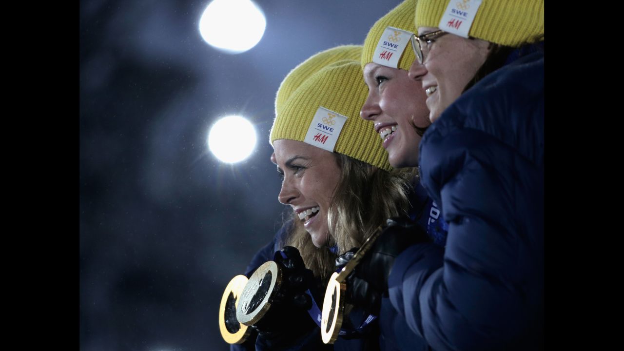The Swedish team celebrates taking the gold in the women's cross-country relay on February 16. 
