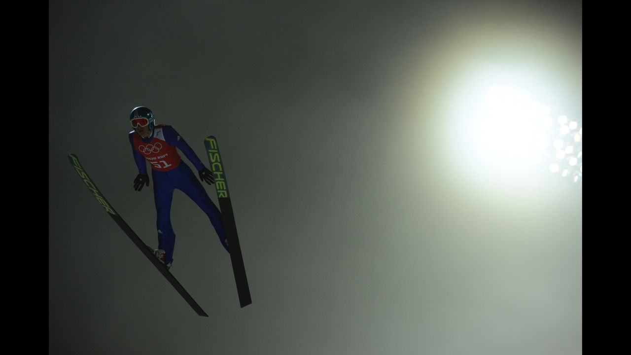 Germany's Richard Freitag jumps in the fog while training for the men's large hill ski jumping event.
