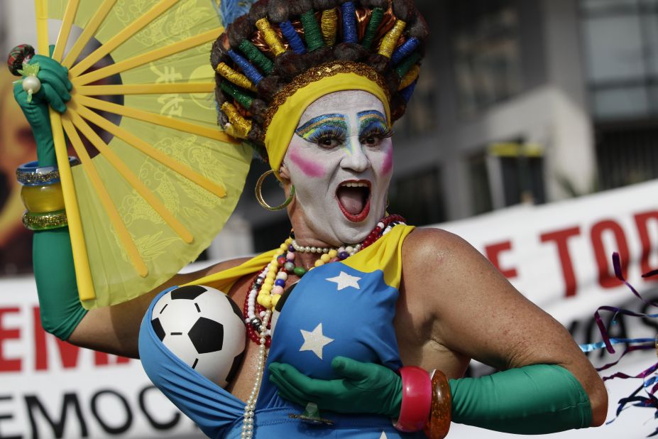 A reveler poses for photos at the Banda de Ipanema carnival parade in Rio de Janeiro on February 15.