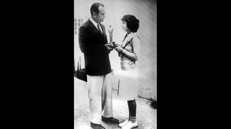 <strong>Janet Gaynor (1929):</strong> Douglas Fairbanks Sr. hands Janet Gaynor her best actress Oscar in 1929 for Gaynor's performance in the 1927 film ''Sunrise." It was the first best actress Oscar ever awarded.