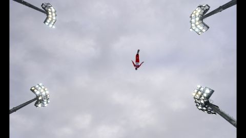 Switzerland's Mischa Gasser takes a warm-up jump before the men's aerials on February 17.