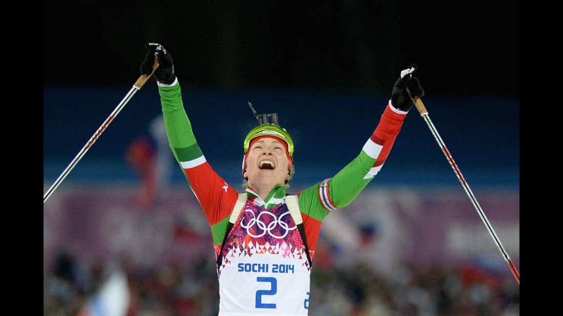 Belarussian biathlete Darya Domracheva celebrates winning the women's 12.5-kilometer mass start event on February 17.
