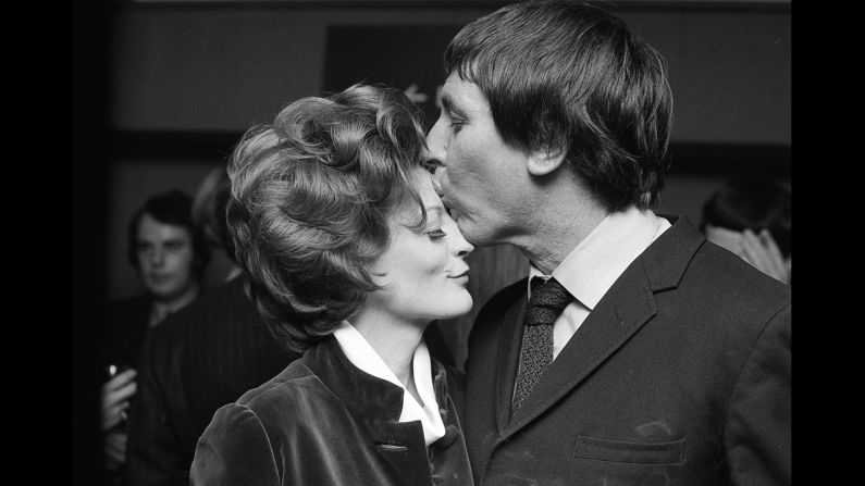 <strong>Maggie Smith (1970):</strong> Maggie Smith, who won for "The Prime of Miss Jean Brodie," celebrates with her husband at the time, Robert Stephens.