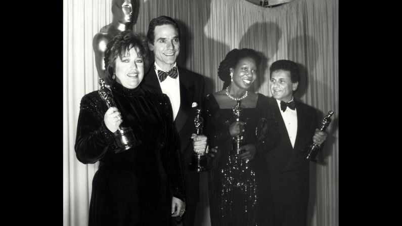 <strong>Kathy Bates (1991):</strong> Kathy Bates, far left, clutches the best actress award for her role in "Misery." To her left are fellow Oscar winners Jeremy Irons, Whoopi Goldberg and Joe Pesci.