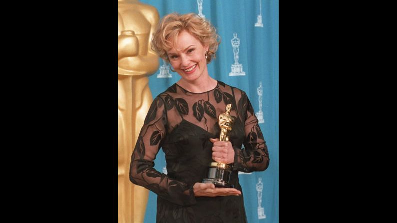 <strong>Jessica Lange (1995):</strong> Jessica Lange holds the Oscar she won for her role in the film "Blue Sky." 