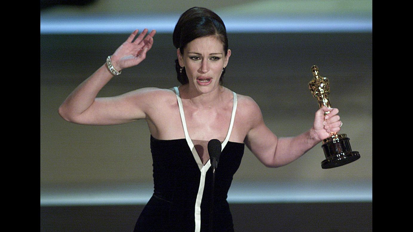 <strong>Julia Roberts (2001):</strong> Julia Roberts holds her Oscar for her role in "Erin Brockovich." 