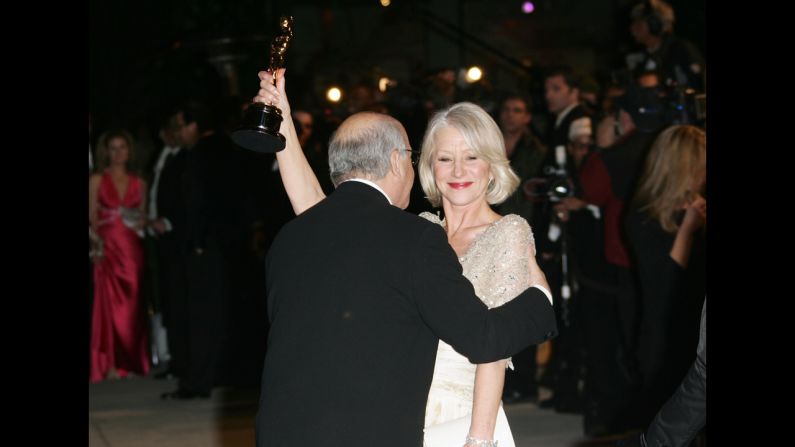 <strong>Helen Mirren (2007):</strong> Director Taylor Hackford kisses his wife, Helen Mirren, after Mirren won the best actress Oscar for her role in "The Queen."