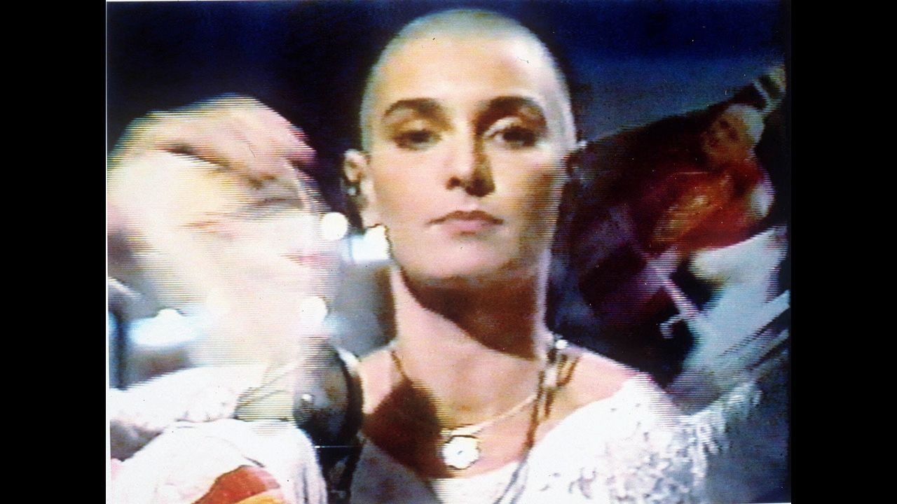 Sinead O'Connor tears up a photo of Pope John Paul II Oct. 5,1992 during a live appearance in New York on NBC's Saturday Night Live.