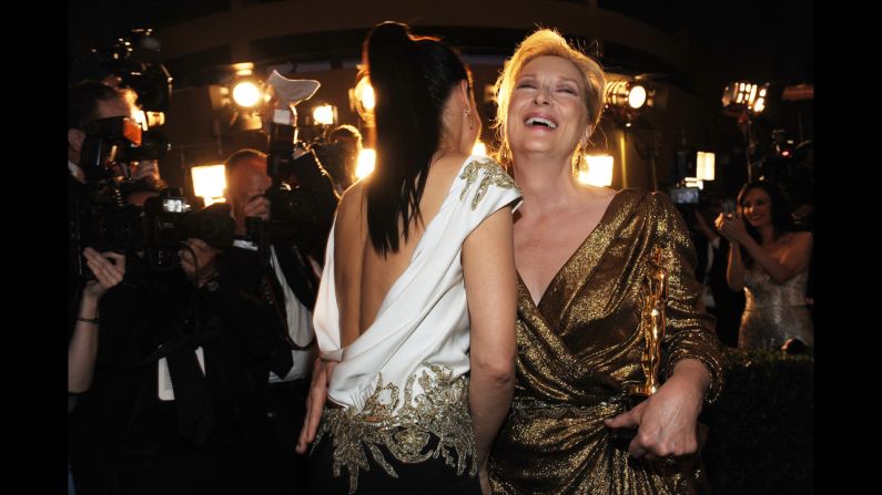 <strong>Meryl Streep (2012):</strong> Meryl Streep, right, laughs with Sandra Bullock after Streep's win for her role in "The Iron Lady."