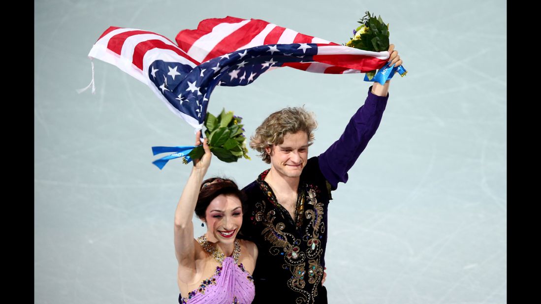 American ice dancers Meryl Davis and Charlie White celebrate winning the Olympic gold medal Monday, February 17, in Sochi, Russia. 