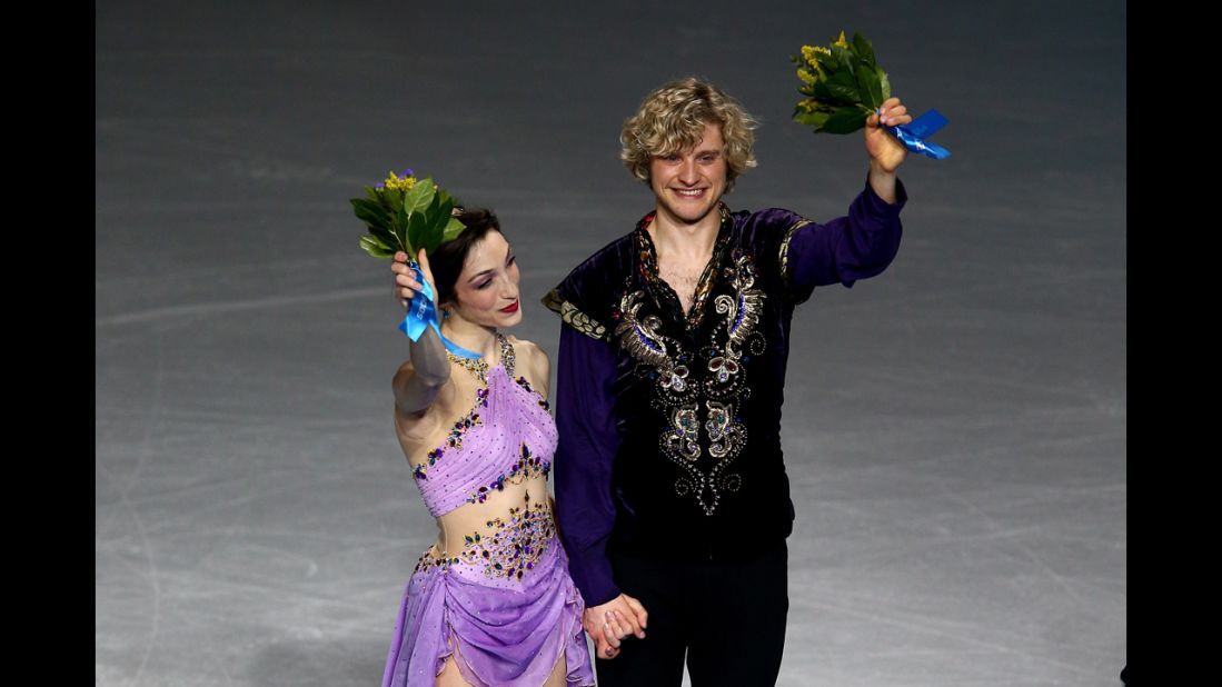 Davis and White celebrate on the podium during the flower ceremony. Canada's Tessa Virtue and Scott Moir, who won gold in 2010, finished in second this time. Russia's Elena Ilinykh and Nikita Katsalapov won the bronze. 