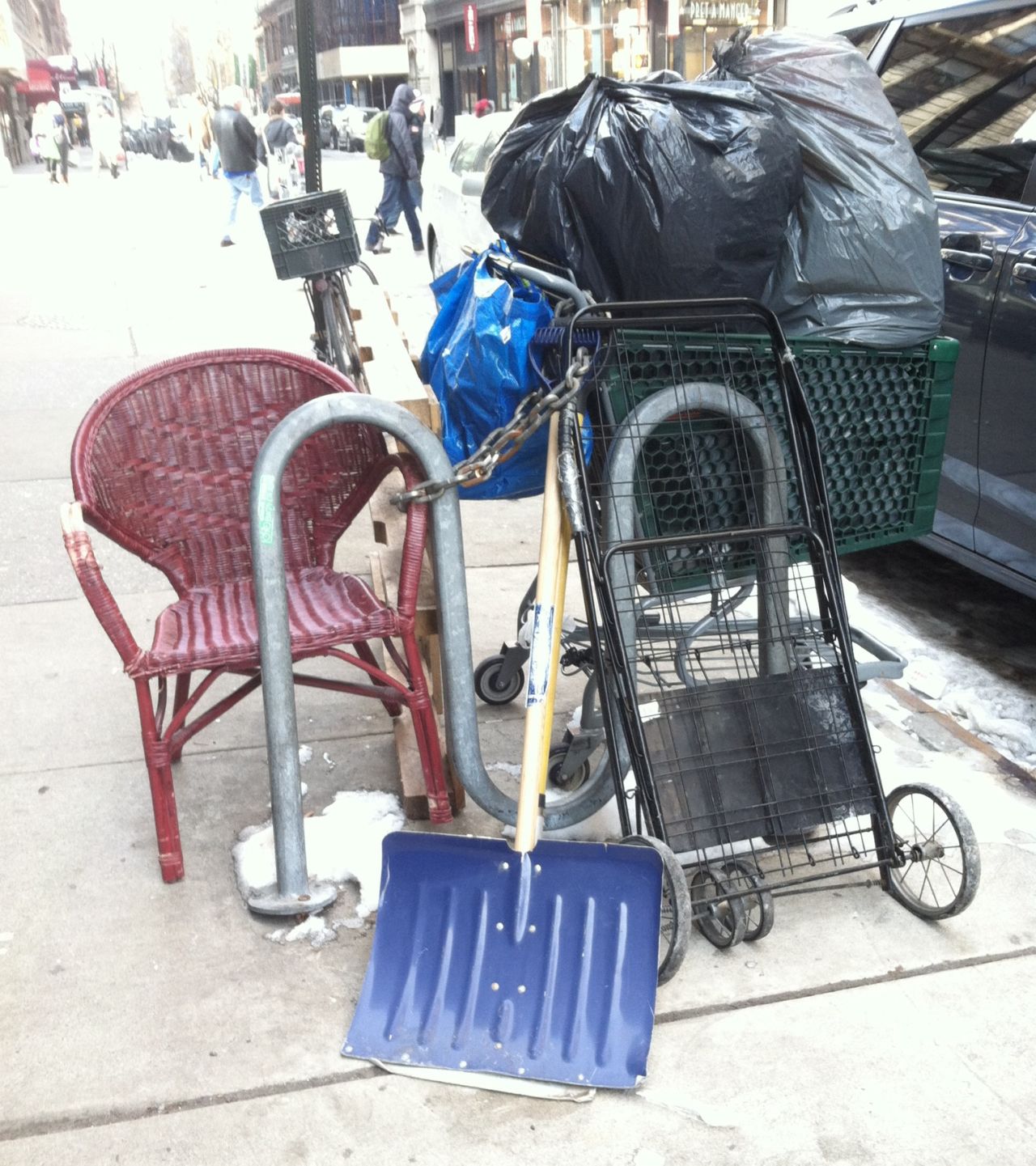 A shopping cart is chained to a bike rack with all its paraphernalia in New York City. "I assumed it belonged to a homeless person who locks it up whenever he or she takes shelter from the cold," <a href="http://ireport.cnn.com/docs/DOC-1082009">Marjorie Zien</a> said. "Based on the appearance, it is definitely 'owned' by someone."