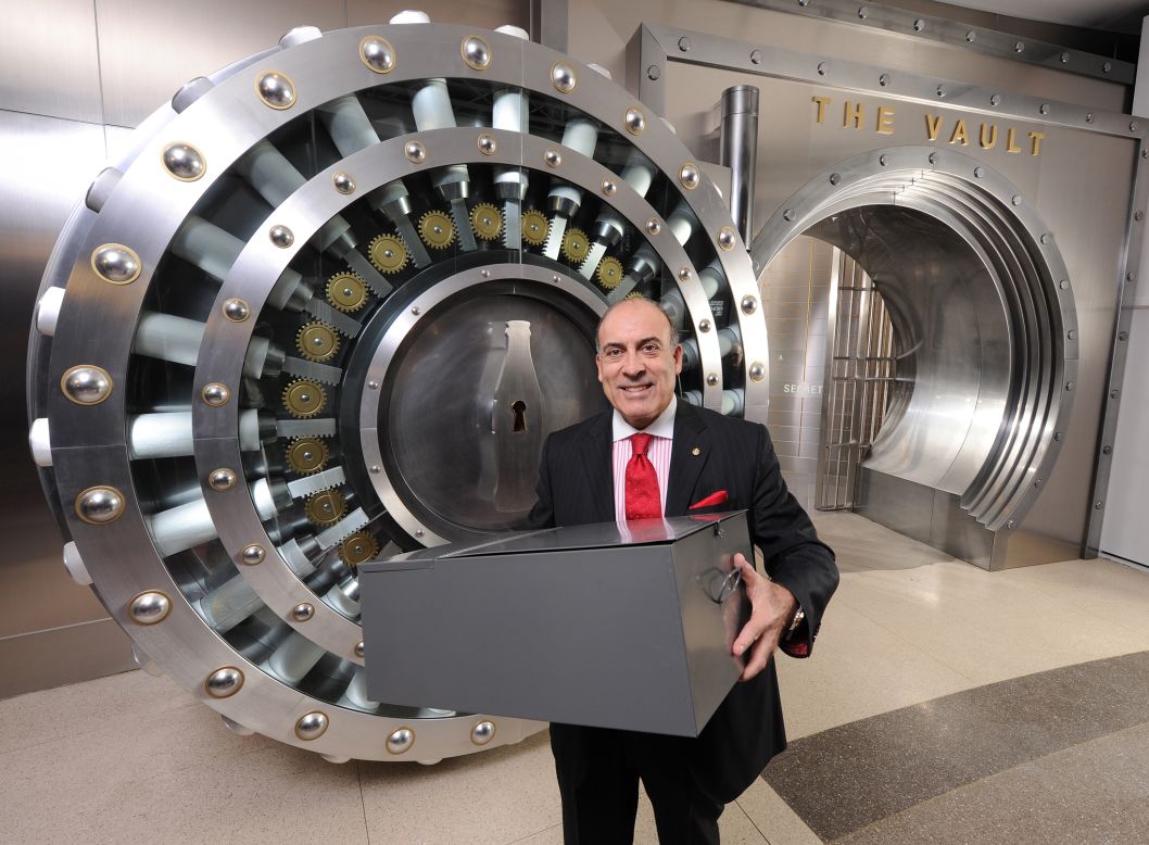 Muhtar Kent, the company's chief executive officer, shows the box containing the recipe, before it's placed inside the multi-million vault.