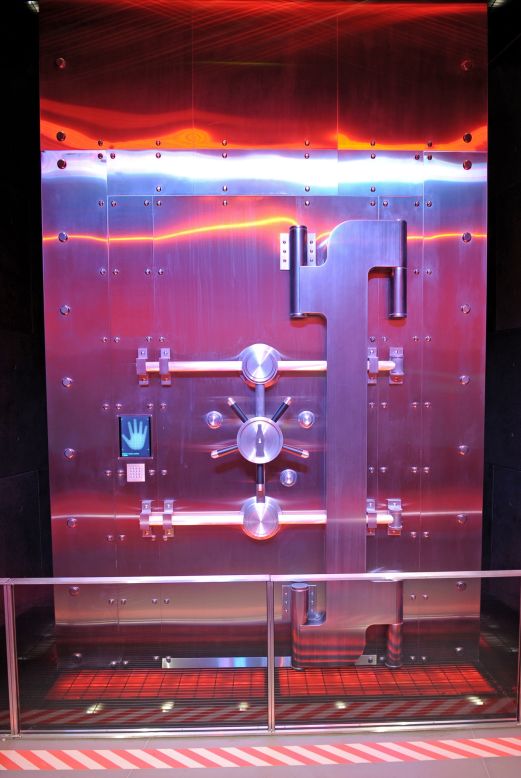The vault's door features several high-tech security locks. Adding to the show factor is special lighting and fake smoke effect. 