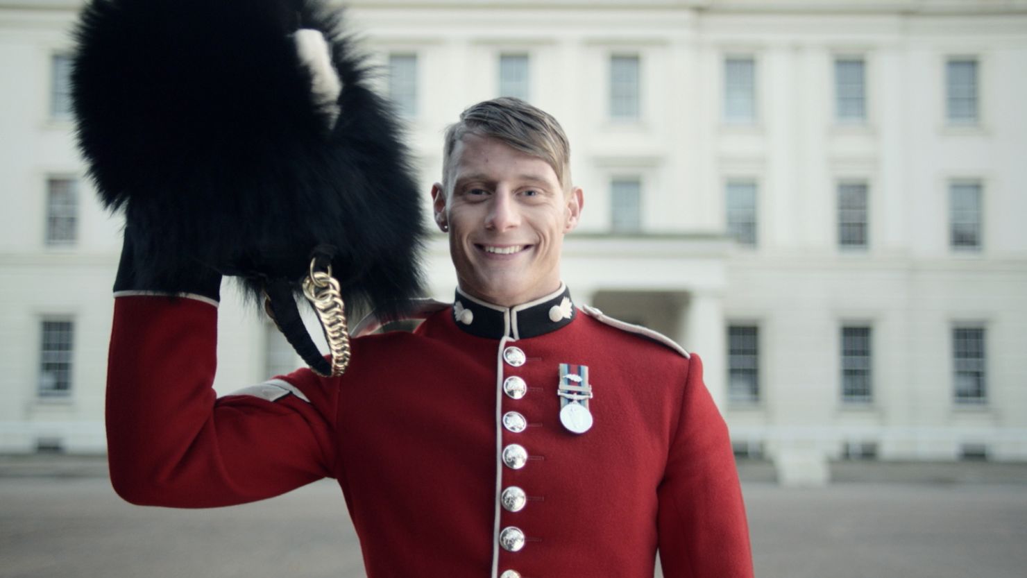 Men in bear-fur hats, steam trains and Indian restaurants feature in VisitBritain ad, but no rain.