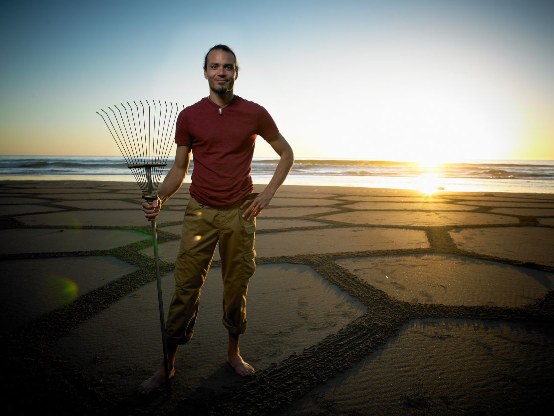 Former computer technician Andres Amador now builds natural homes and creates artwork on beaches.