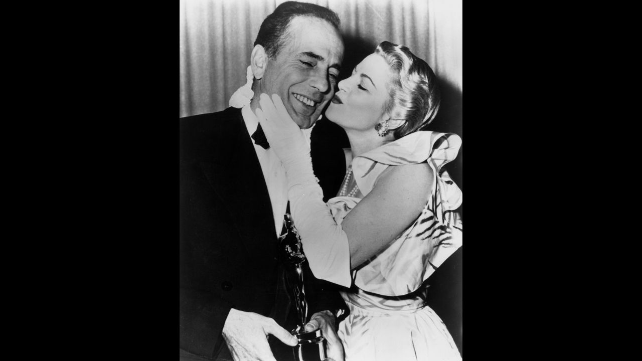 <strong>Humphrey Bogart (1952):</strong> Claire Trevor can't resist giving Humphrey Bogart a kiss backstage at the 1952 Oscars ceremony after he won the best actor award for "The African Queen." Bogart beat out Marlon Brando in "A Streetcar Named Desire," Fredric March in "Death of a Salesman" and Montgomery Clift in "A Place in the Sun."