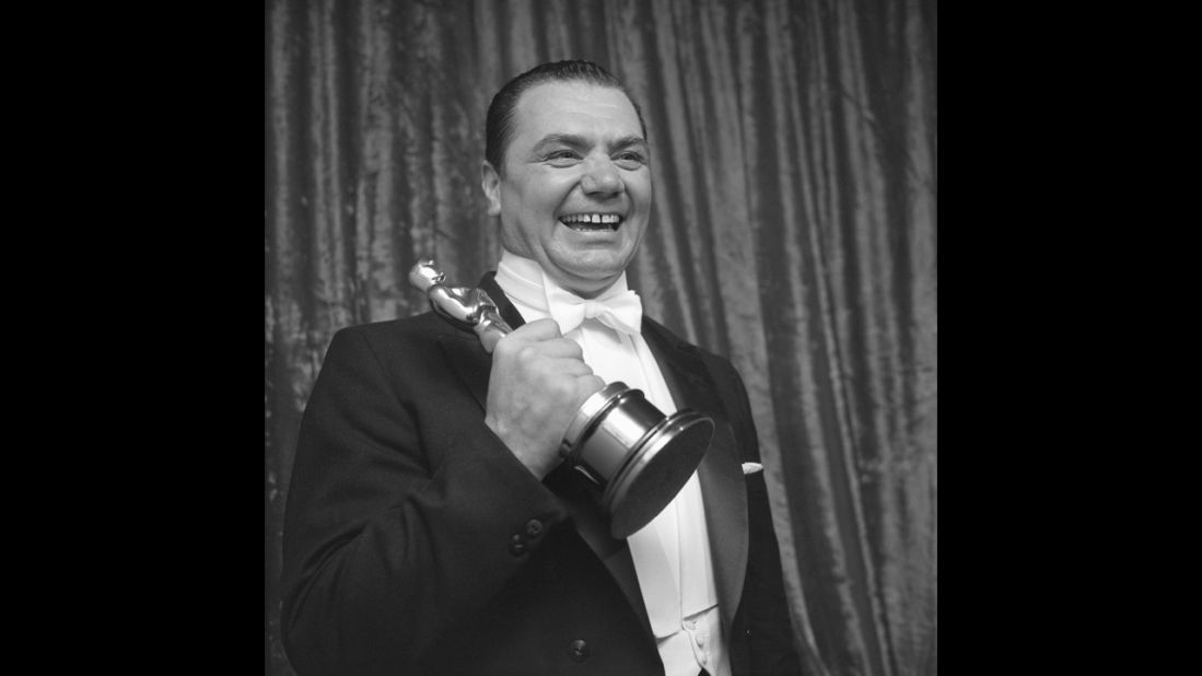 <strong>Ernest Borgnine (1956):</strong> Ernest Borgnine faced heavy competition for best actor, beating out James Dean ("East of Eden"), Frank Sinatra ("The Man With the Golden Arm"), James Cagney ("Love Me or Leave Me") and Spencer Tracy ("Bad Day at Black Rock"). Backstage at the 1956 ceremony, Borgnine holds the Oscar for his portrayal of a lonely butcher in "Marty."