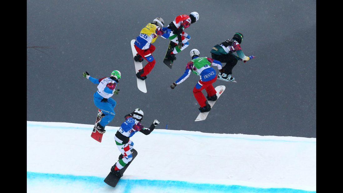 Athletes compete February 18 in a snowboard cross semifinal.